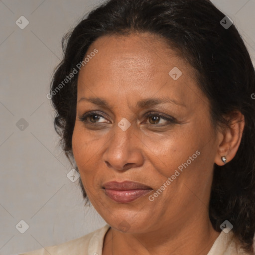 Joyful black adult female with medium  brown hair and brown eyes