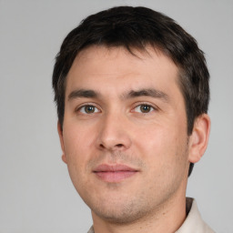 Neutral white young-adult male with short  black hair and brown eyes