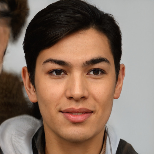 Joyful asian young-adult male with medium  brown hair and brown eyes