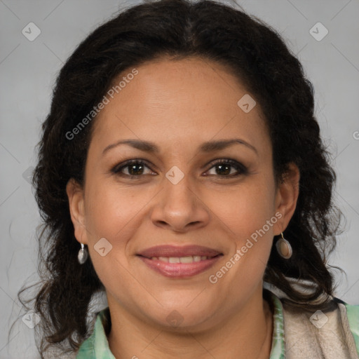 Joyful latino adult female with medium  brown hair and brown eyes