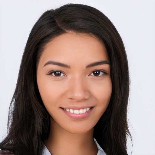 Joyful latino young-adult female with long  brown hair and brown eyes