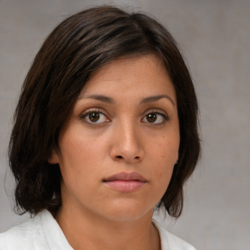 Neutral white young-adult female with medium  brown hair and brown eyes