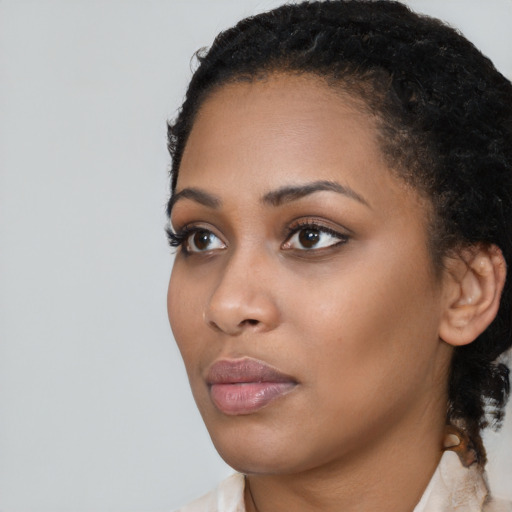 Neutral black young-adult female with short  black hair and brown eyes
