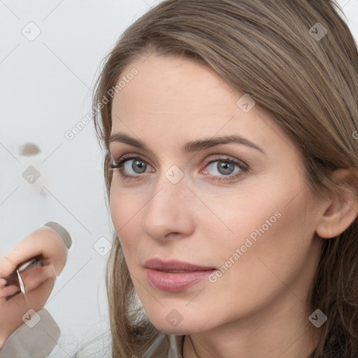 Neutral white young-adult female with long  brown hair and brown eyes