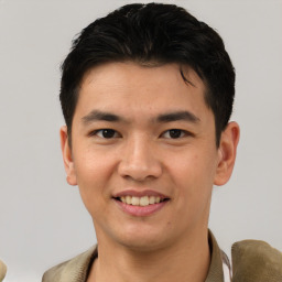 Joyful asian young-adult male with short  brown hair and brown eyes