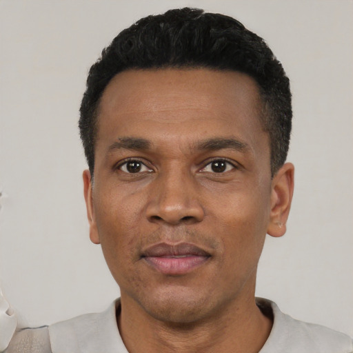 Neutral black adult male with short  black hair and brown eyes