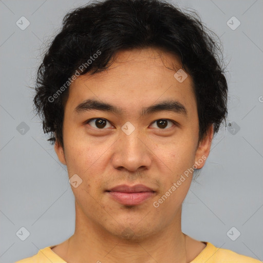 Joyful asian young-adult male with short  brown hair and brown eyes