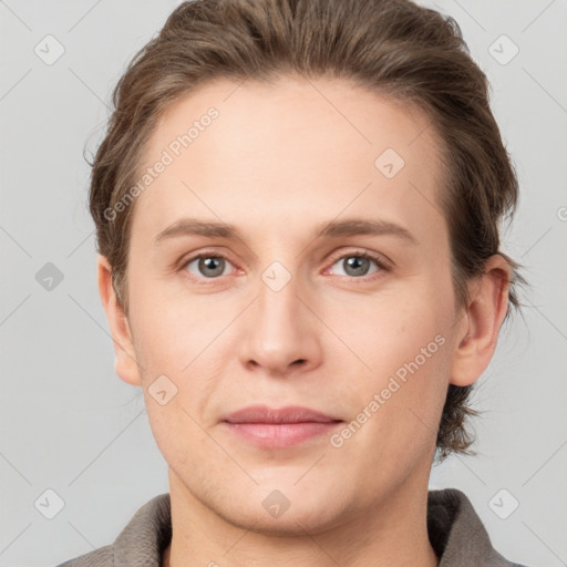 Joyful white young-adult female with short  brown hair and grey eyes