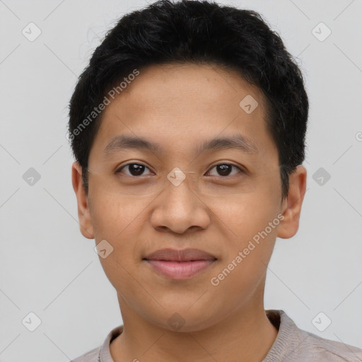 Joyful latino young-adult male with short  brown hair and brown eyes