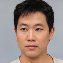 Neutral asian young-adult male with short  black hair and brown eyes