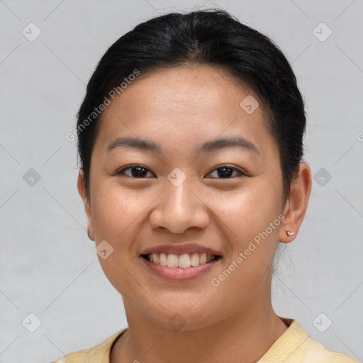 Joyful asian young-adult female with short  brown hair and brown eyes