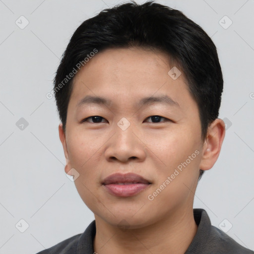 Joyful asian young-adult male with short  black hair and brown eyes