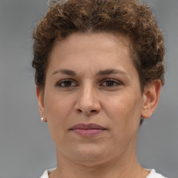 Joyful white adult female with short  brown hair and brown eyes