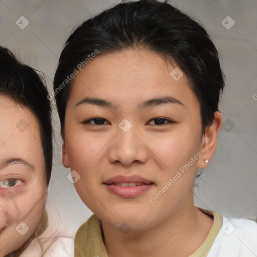 Joyful asian young-adult female with medium  brown hair and brown eyes