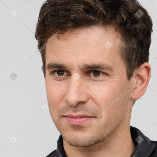 Joyful white adult male with short  brown hair and brown eyes