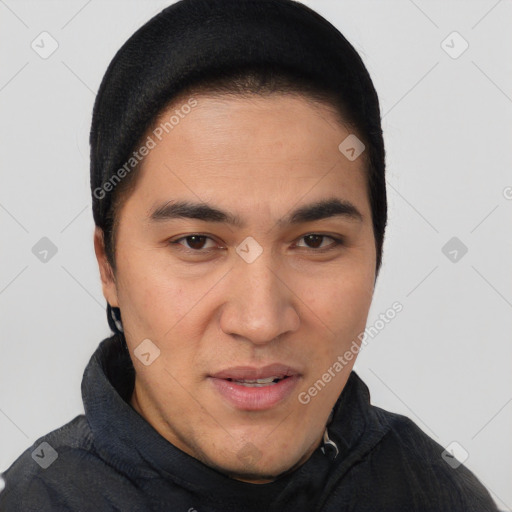 Joyful latino young-adult male with short  brown hair and brown eyes