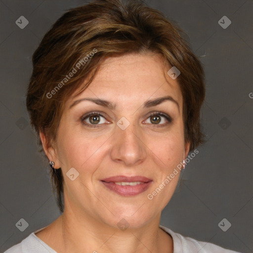 Joyful white adult female with short  brown hair and grey eyes