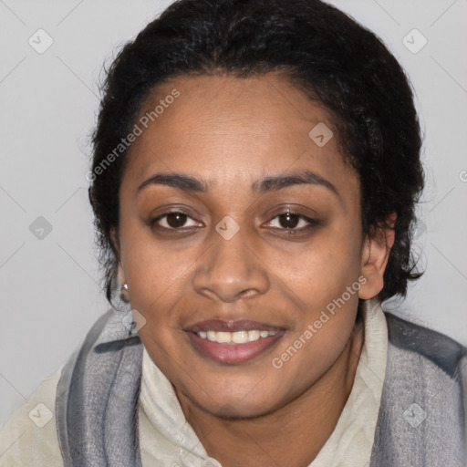 Joyful black adult female with medium  black hair and brown eyes