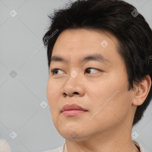 Neutral asian young-adult male with short  black hair and brown eyes