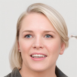 Joyful white young-adult female with medium  brown hair and blue eyes