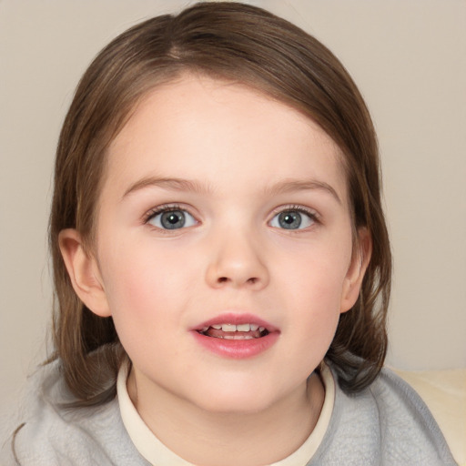 Joyful white child female with medium  brown hair and blue eyes