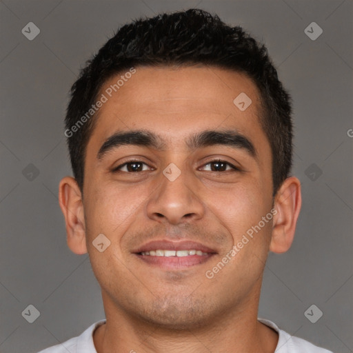 Joyful latino young-adult male with short  brown hair and brown eyes