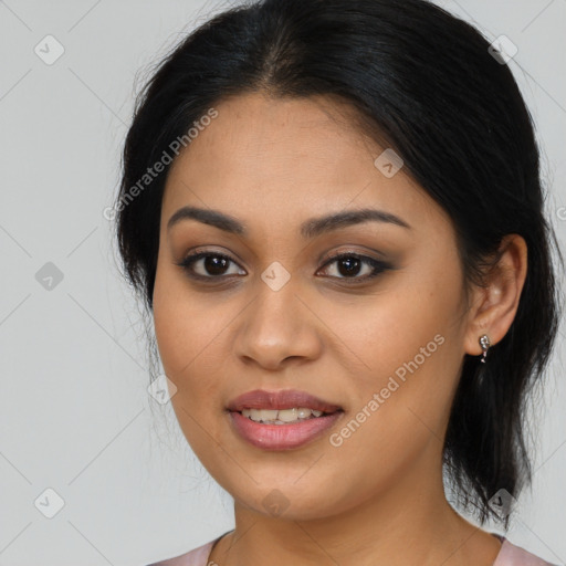 Joyful latino young-adult female with long  brown hair and brown eyes