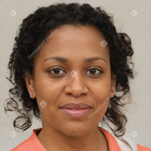Joyful black adult female with medium  brown hair and brown eyes