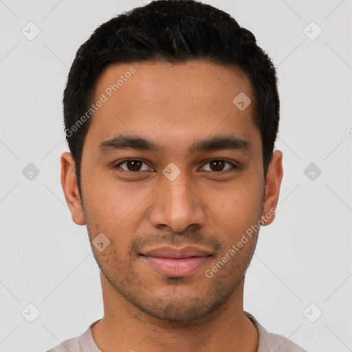 Joyful latino young-adult male with short  black hair and brown eyes