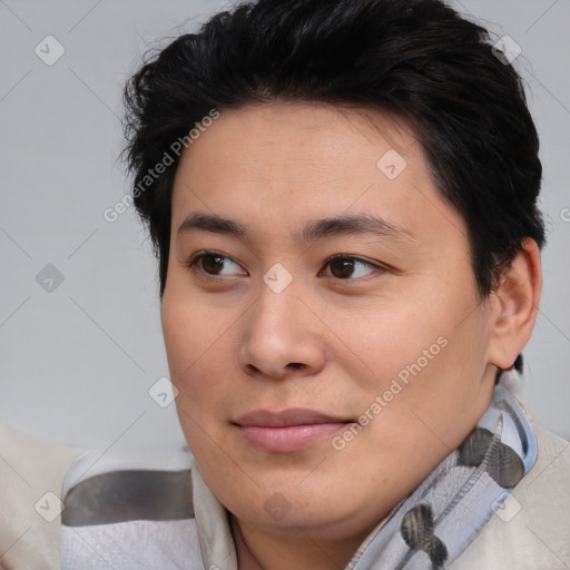 Joyful asian young-adult female with short  brown hair and brown eyes