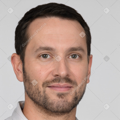 Joyful white adult male with short  brown hair and brown eyes