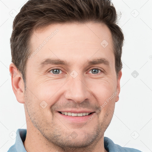 Joyful white adult male with short  brown hair and grey eyes