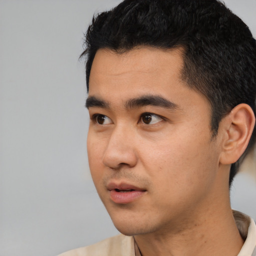 Neutral asian young-adult male with short  black hair and brown eyes