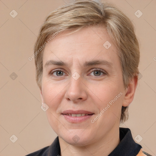 Joyful white adult female with short  brown hair and grey eyes