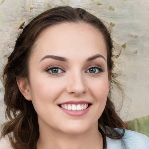 Joyful white young-adult female with medium  brown hair and blue eyes