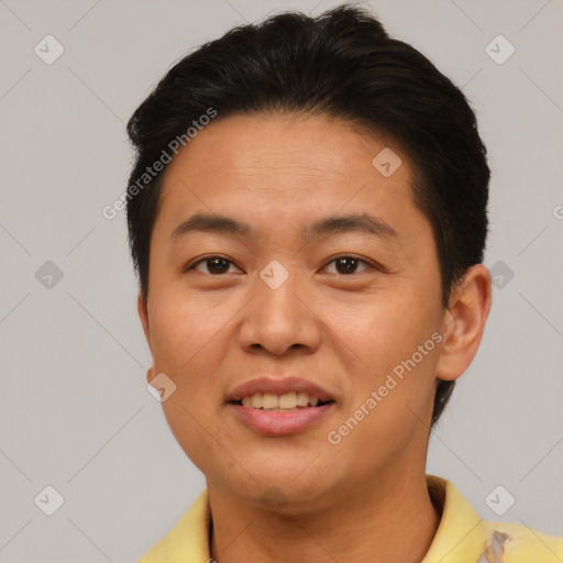 Joyful asian young-adult male with short  brown hair and brown eyes