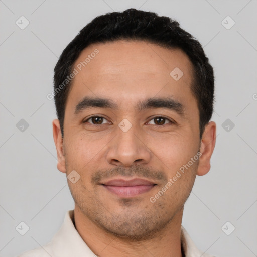 Joyful latino young-adult male with short  black hair and brown eyes