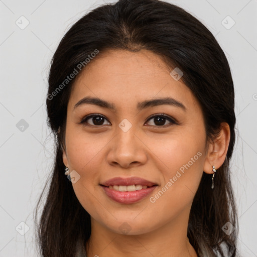 Joyful asian young-adult female with long  brown hair and brown eyes