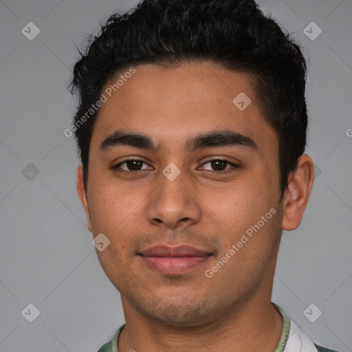 Joyful latino young-adult male with short  black hair and brown eyes