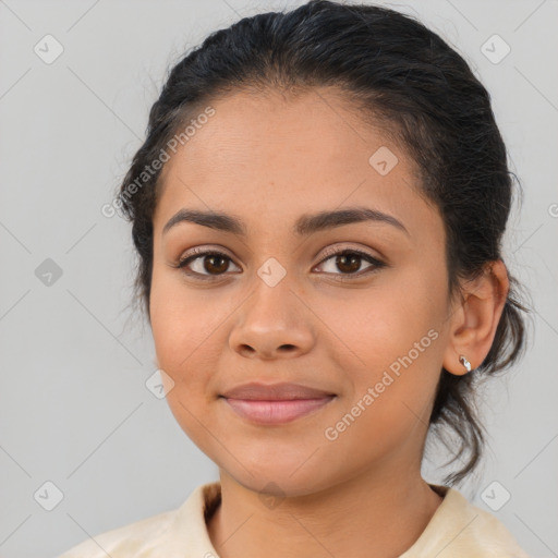 Joyful latino young-adult female with medium  brown hair and brown eyes