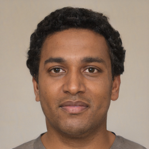 Neutral black young-adult male with short  black hair and brown eyes