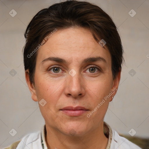 Joyful white adult female with short  brown hair and brown eyes