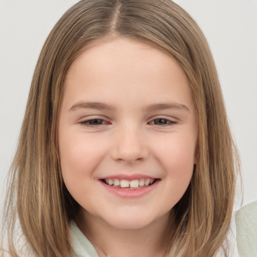 Joyful white child female with long  brown hair and brown eyes