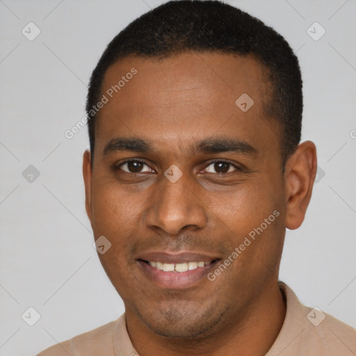 Joyful latino young-adult male with short  brown hair and brown eyes