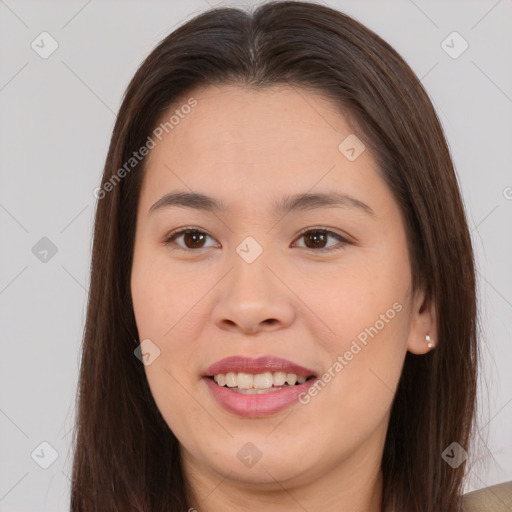 Joyful asian young-adult female with long  brown hair and brown eyes