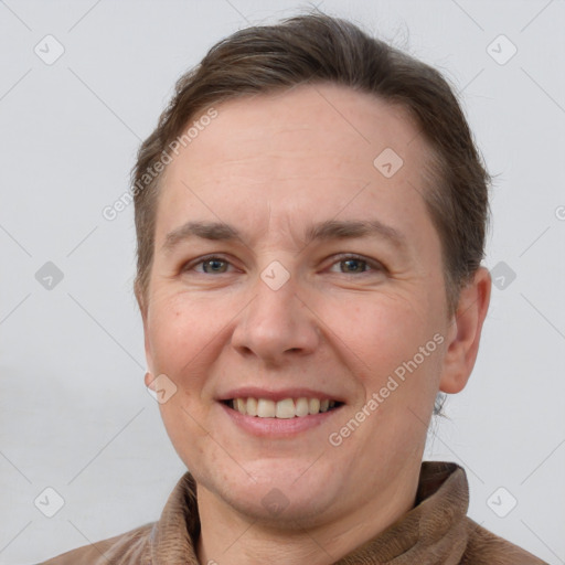 Joyful white adult female with short  brown hair and brown eyes