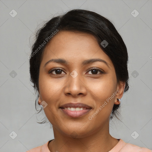 Joyful latino young-adult female with short  black hair and brown eyes