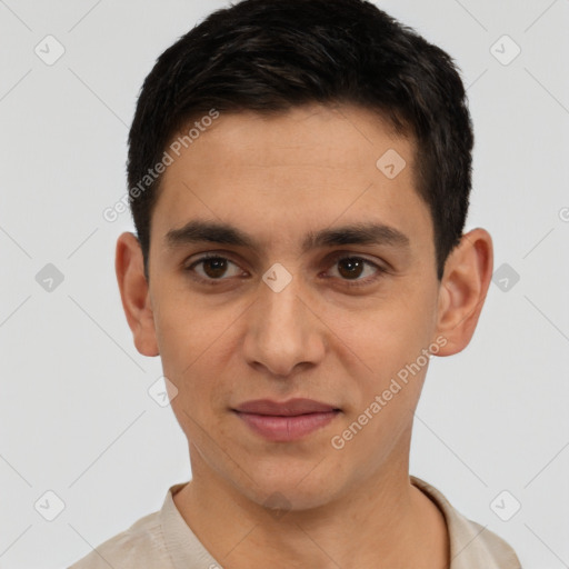 Joyful white young-adult male with short  black hair and brown eyes