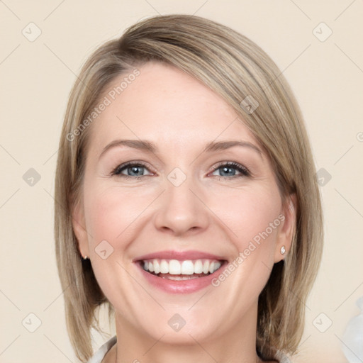 Joyful white young-adult female with medium  brown hair and blue eyes