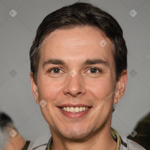 Joyful white adult male with short  brown hair and brown eyes